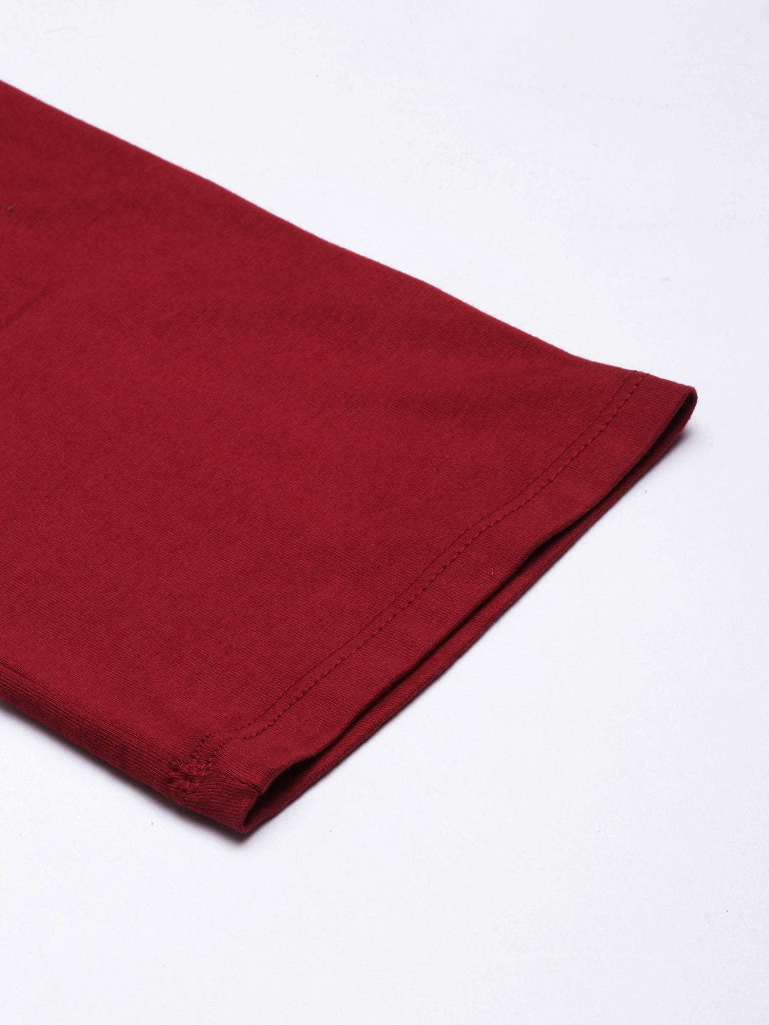 Maroon ankle hem close-up with neat stitched edge