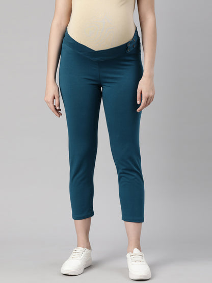 Maternity capri pants in deep blue with under-belly panel, slim ankle-length fit