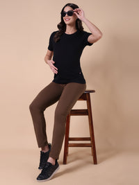 Brown maternity pants with adjustable waist, side view and ankle hem