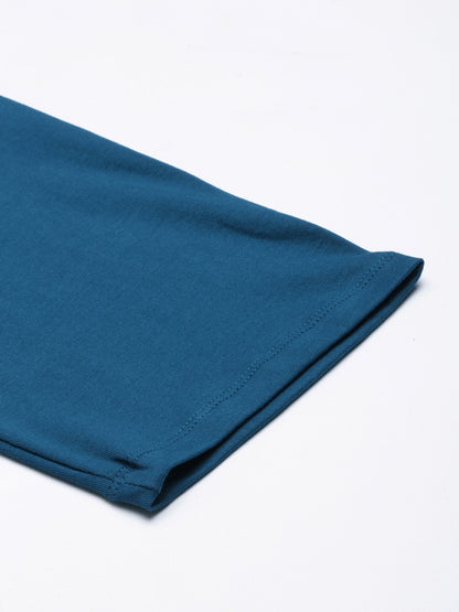 Deep blue maternity pants ankle hem with stitched edge and tapered leg opening