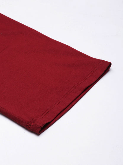 Maroon ankle hem close-up with neat stitched edge